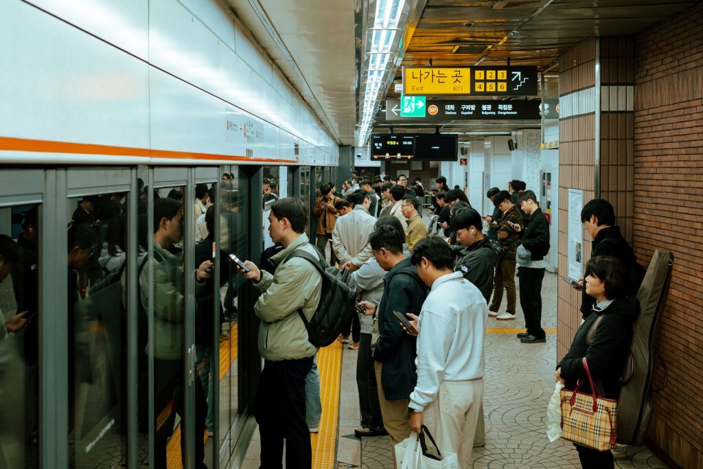 People waiting for a train at a subway station.