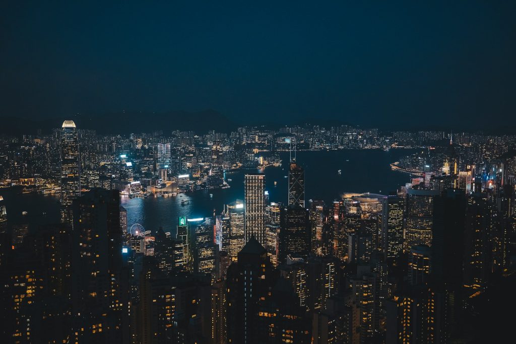 Vast cityscape illuminated at night with a dark sky.